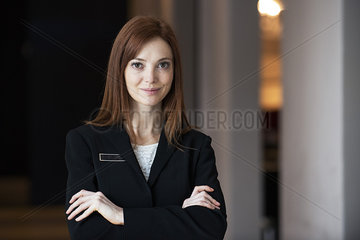 Female receptionist standing in hotel