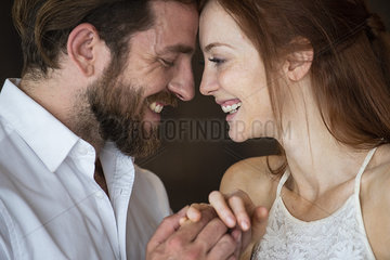 Close-up of couple touching heads