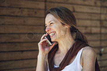 Mature woman talking on smart phone