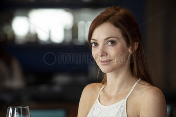 Mid adult woman sitting in bar