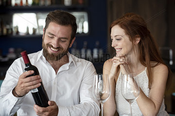 Mid adult couple sitting in bar