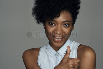 Close-up of young woman gesturing