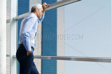 Businessman standing near window
