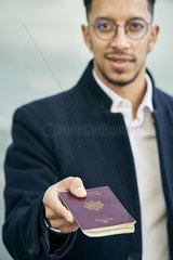 Businessman holding passport