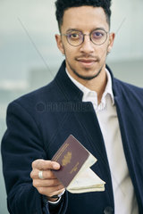 Businessman holding passport