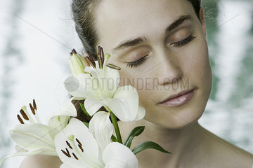 Young woman with lilies