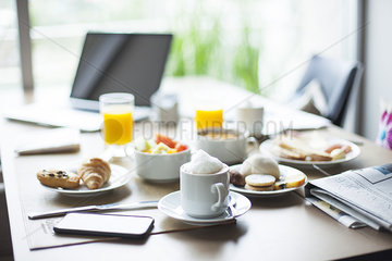 Coffee and breakfast on cafe table