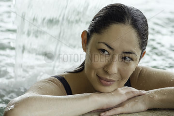 Woman relaxing in pool