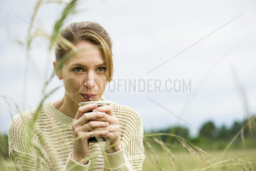 Woman drinking yerba mate  portrait