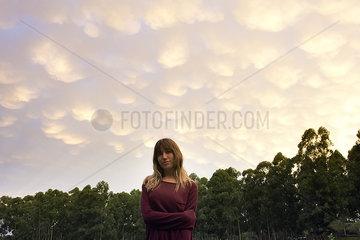 Young woman outdoors at dusk  portrait