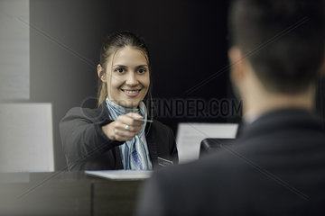 Bank teller helping customer
