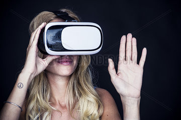 Woman using virtual reality simulator