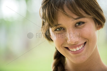 Young woman smiling cheerfully  portrait