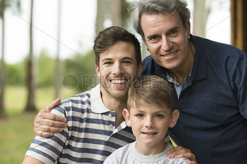Mature man with son and grandson  portrait