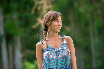 Young woman smiling outdoors  portrait