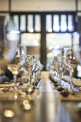 Wineglasses arranged on dining table