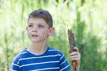 Boy hiking in woods