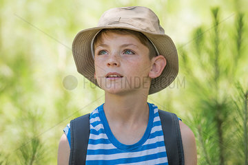 Boy outdoors  looking up in awe  portrait