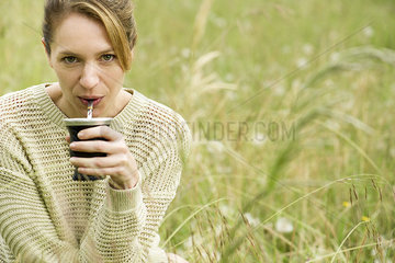 Woman drinking yerba mate  portrait