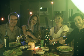People having dinner together outdoors