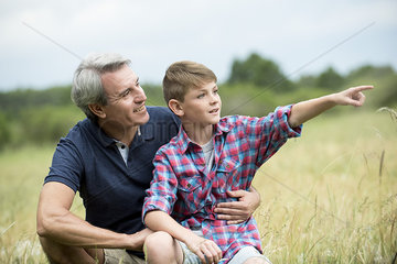 Grandfather and grandson spending time together outdoors