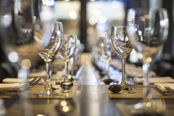Wineglasses arranged on dining table