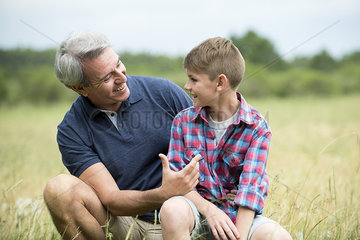 Grandfather and grandson bonding outdoors