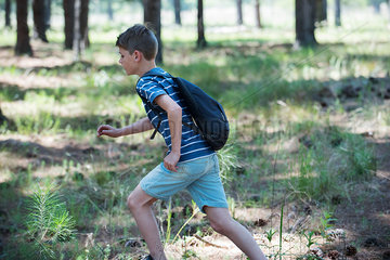 Boy running outdoors