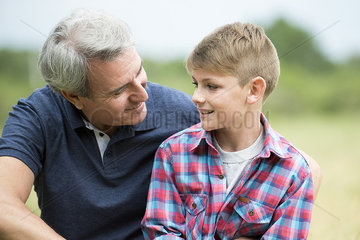 Grandfather and grandson outdoors  portrait