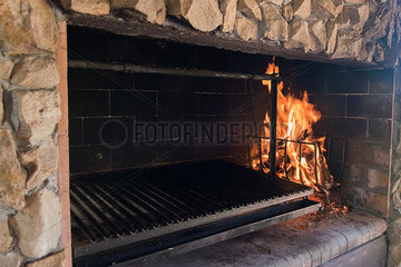 Grill set in stone wall