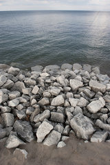Rocks piled along shore
