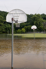 Flooded outdoor basketball court