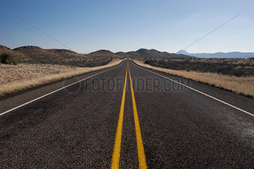 Highway through arid landscape