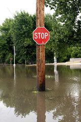 Stop sign on flooded street