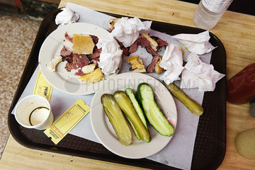 Remnants of deli sandwich on tray