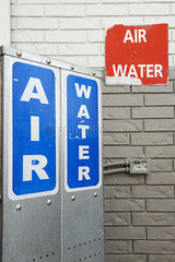 Signs advertising air and water pumps