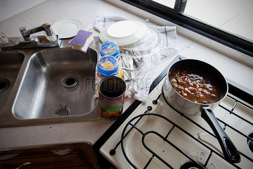 Canned soup cooking on stovetop in motor home