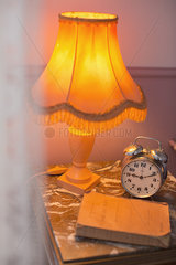 Lamp  alarm clock on bedside table