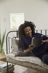 Woman shopping online using digital tablet