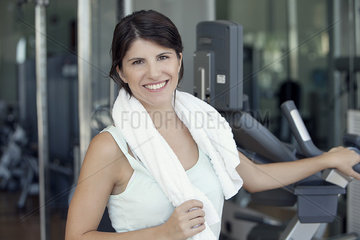Woman smiling after workout in fitness club  portrait