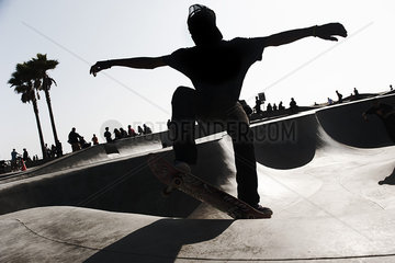 Young man skateboarding in skate park
