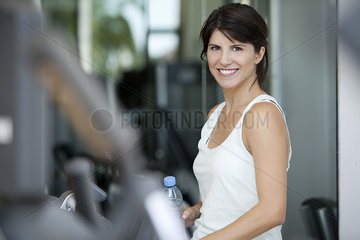 Woman smiling in fitness club  portrait