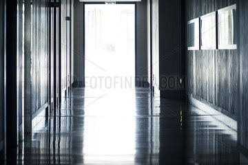Open door at end of hallway