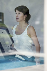 Woman exercising in fitness club