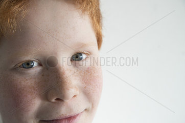 Boy with red hair and freckles  close-up portrait