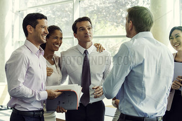 Business team members having lighthearted moment together