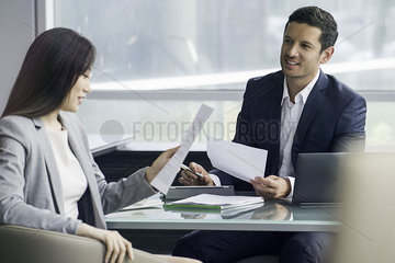 Business associates reviewing document