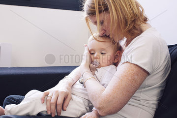Mother holding baby on lap