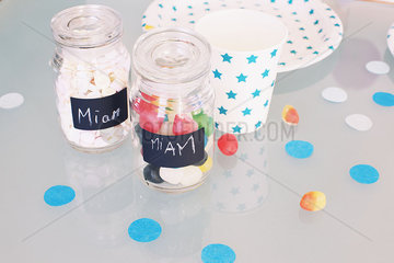 Jars of candy and party accessories