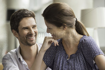 Couple smiling together at home